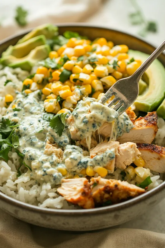 A bowl of food with chicken, rice, and corn.