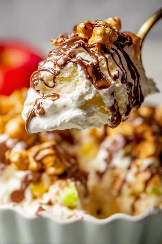 A close up of a caramel apple snickers salad.