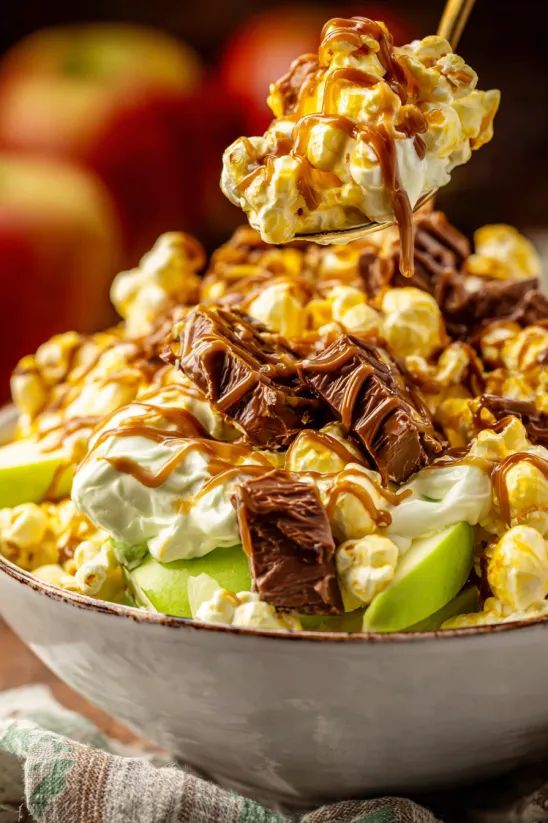 A bowl of Caramel Apple Snickers Salad.
