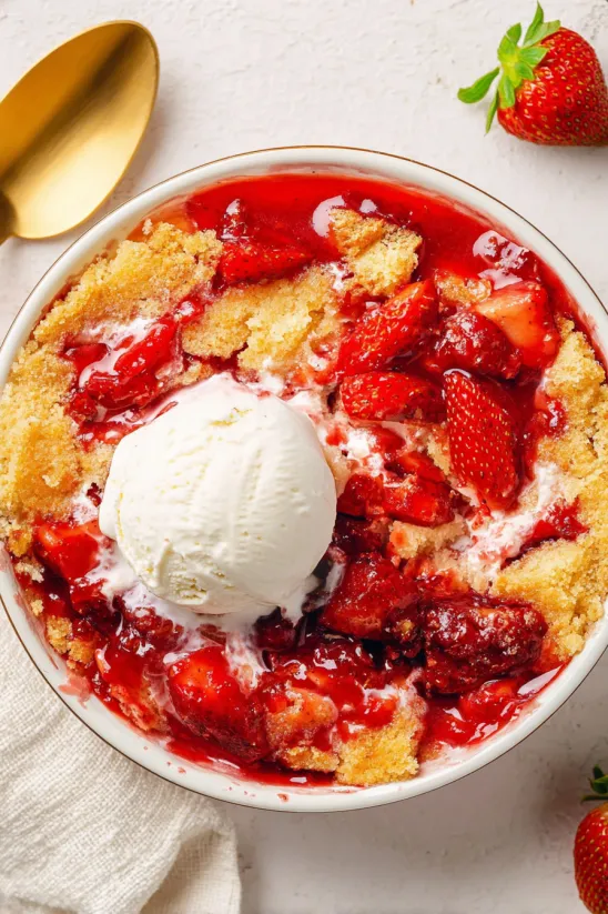 A bowl of strawberry dump cake.