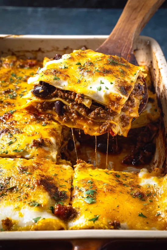 A close up of a Mexican lasagna.