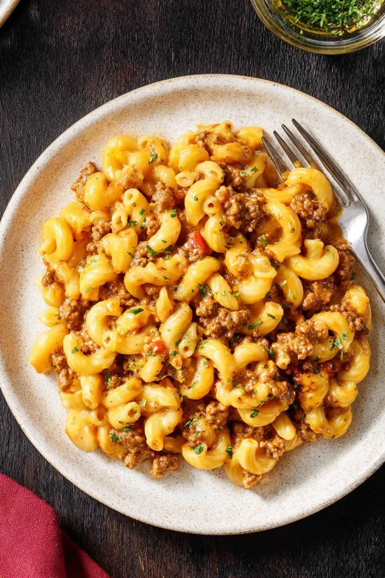 A plate of macaroni and meat.