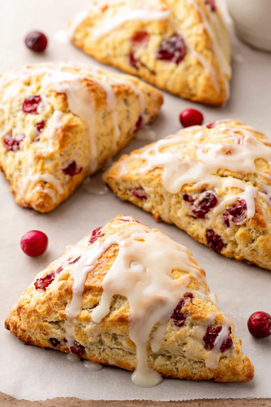 A close up of a cranberry orange scone.
