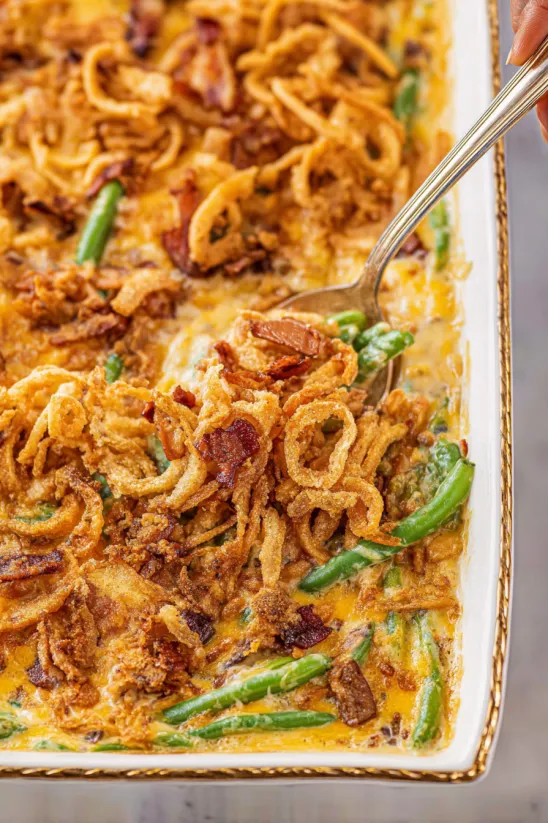 A close up of a cheesy green bean casserole.