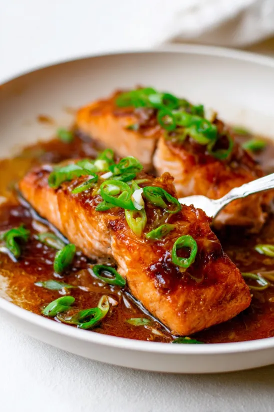A plate of teriyaki salmon.