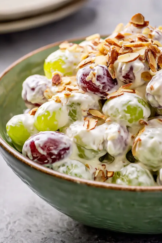 A bowl of creamy grape salad.