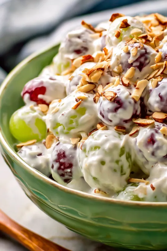 A bowl of creamy grape salad.