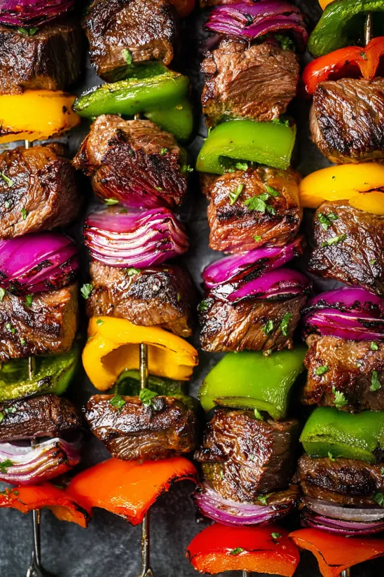 Steak kabobs with peppers and onions.