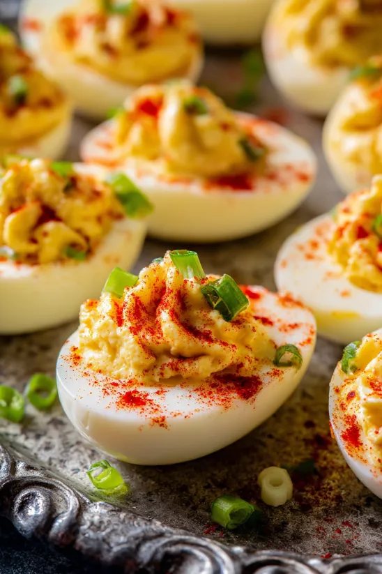 A plate of deviled eggs with pimento cheese.