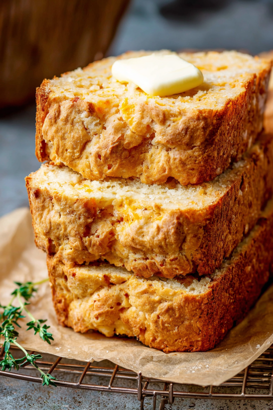 A stack of bread with butter on top.