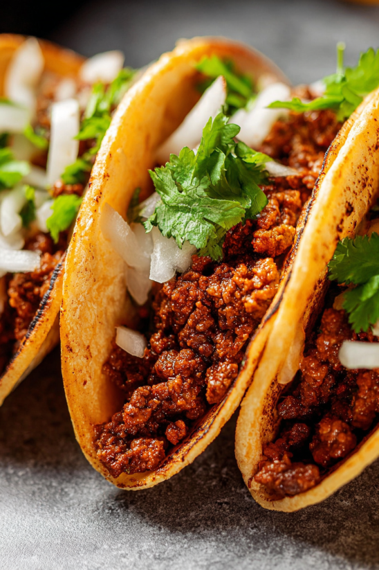 A close up of a spicy taco meat.