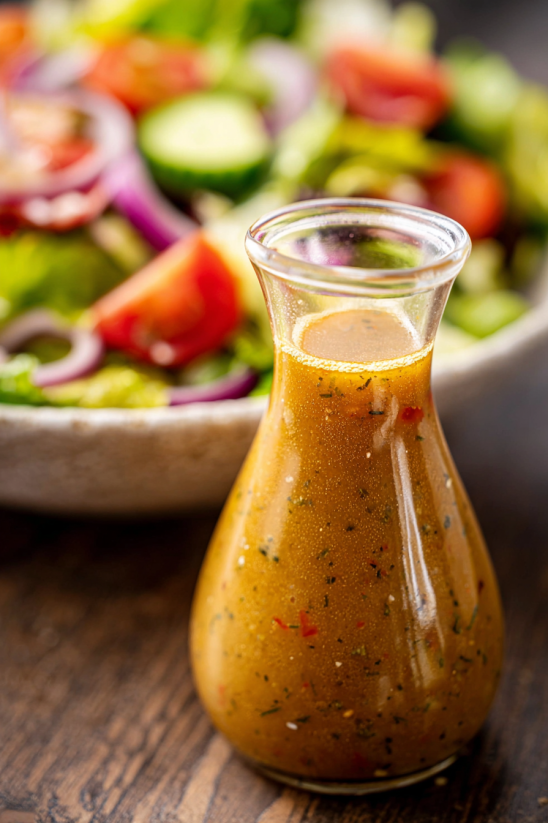 A bottle of Greek salad dressing.
