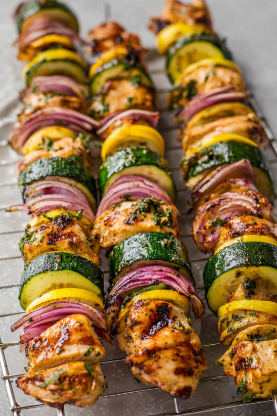 Grilled chicken kabobs with zucchini, onions, and peppers.