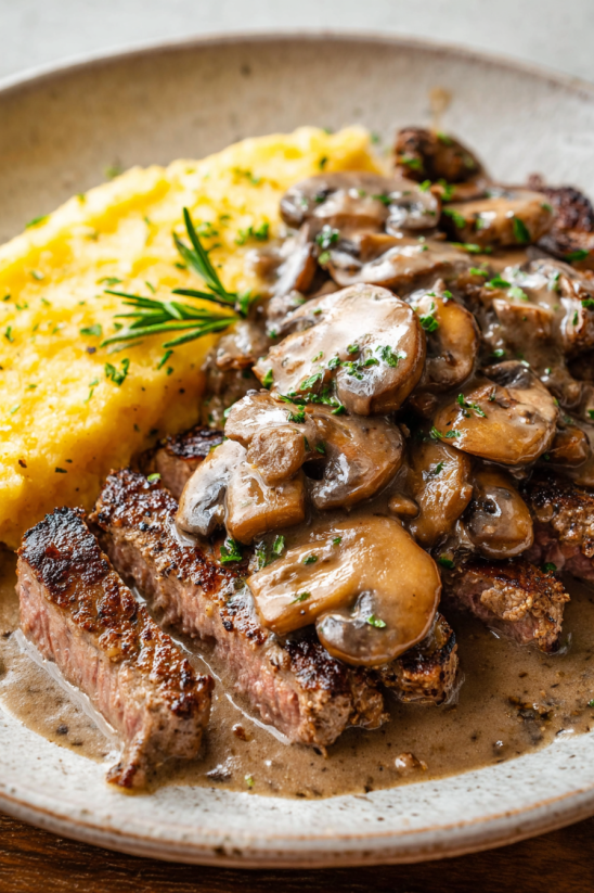 A plate of food with mushrooms and a sauce.