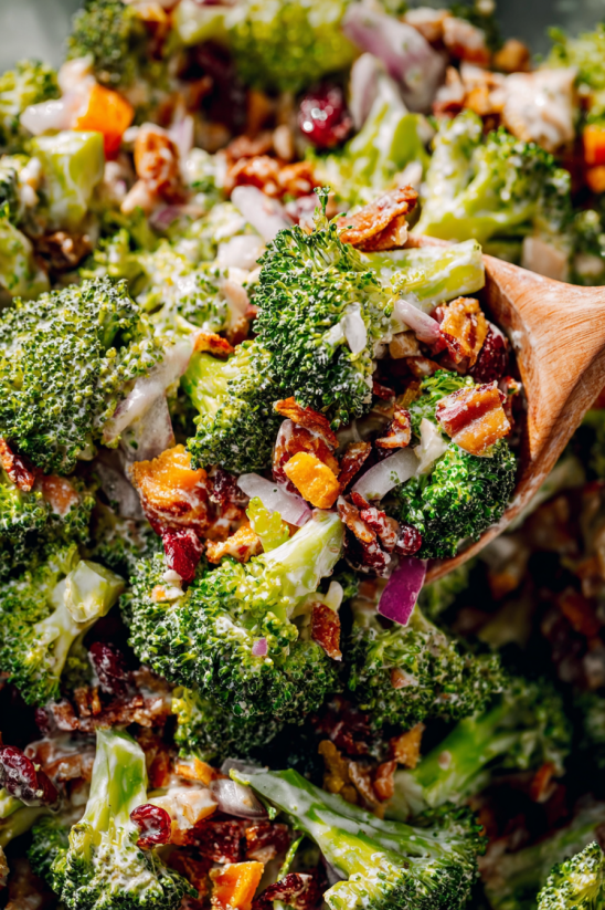 A salad with broccoli and bacon.