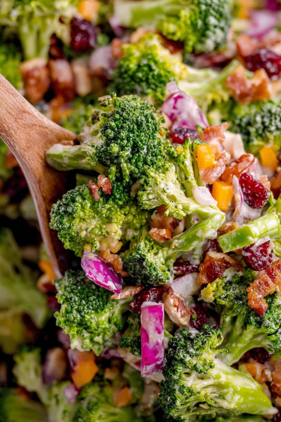 A salad with broccoli and bacon.