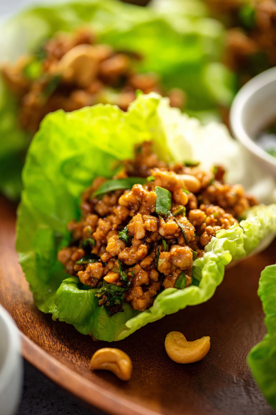 A close up of a chicken lettuce wrap.