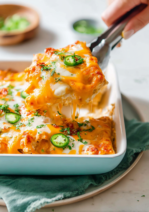 A slice of cheese enchilada with green peppers.