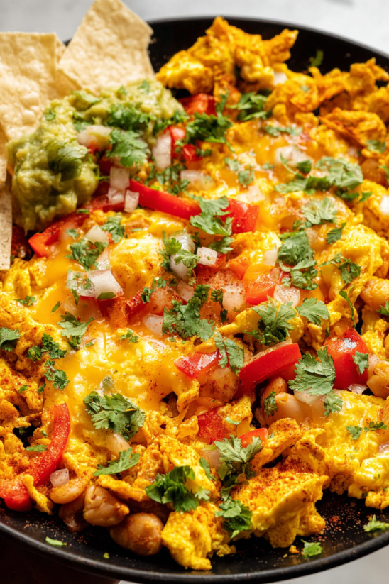 Migas with tomatoes, onions, and cheese.