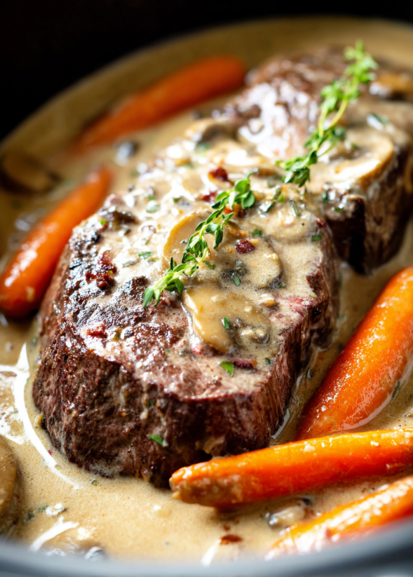 A delicious pot roast with mushrooms and carrots.