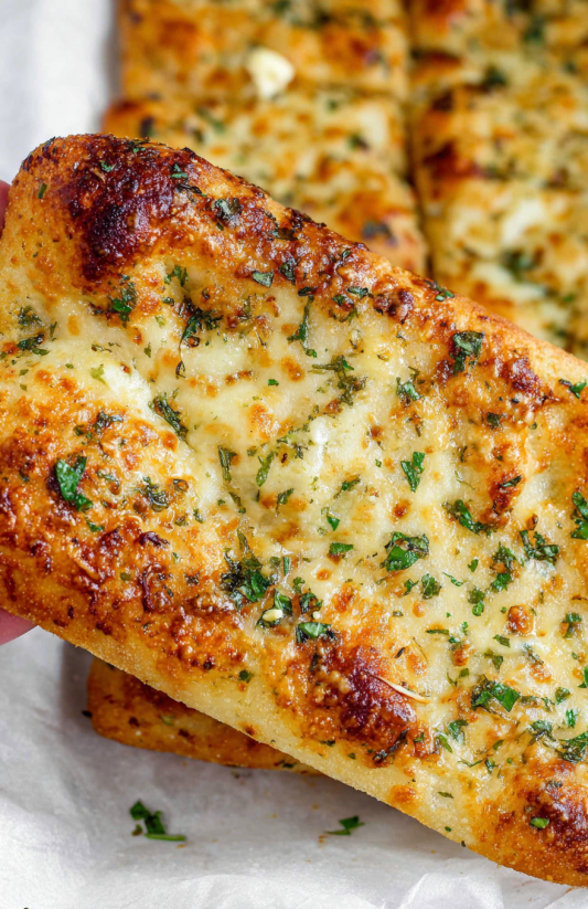 A slice of garlic bread.