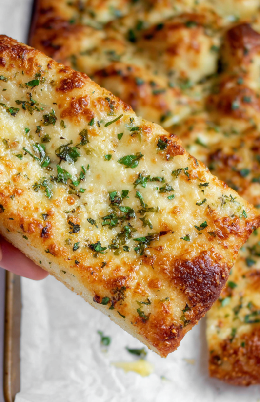 A slice of garlic bread.