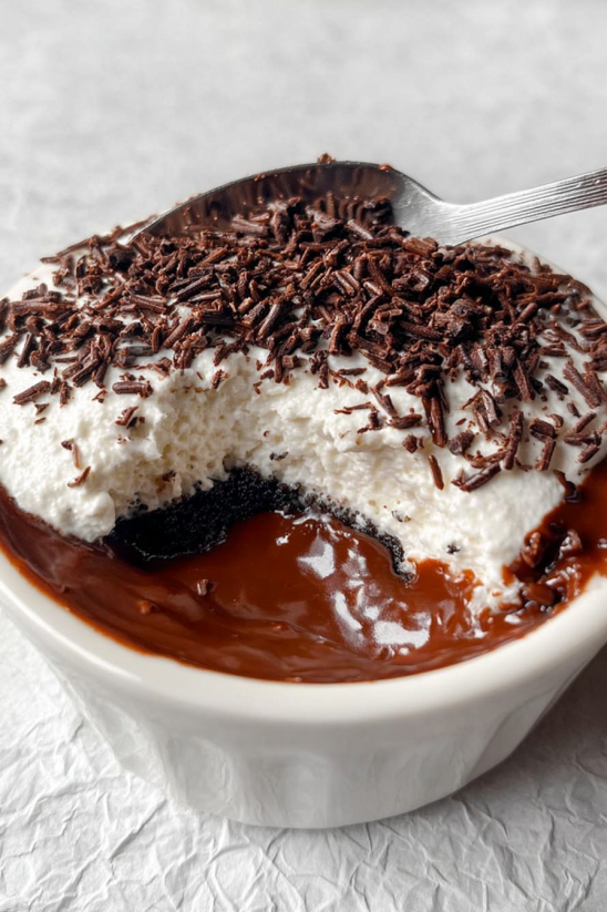 A bowl of chocolate cake with Oreo cookies.