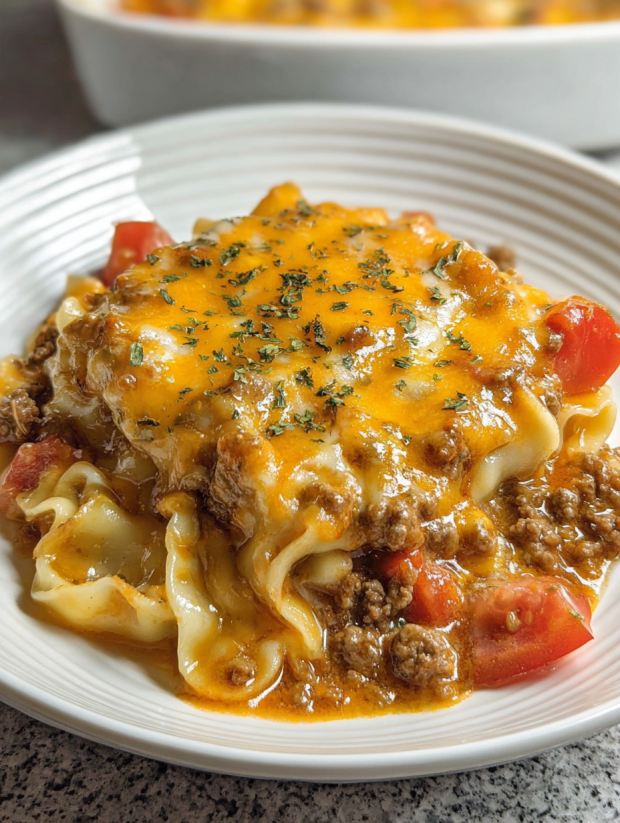 A plate of food with a cheesy taco mac.