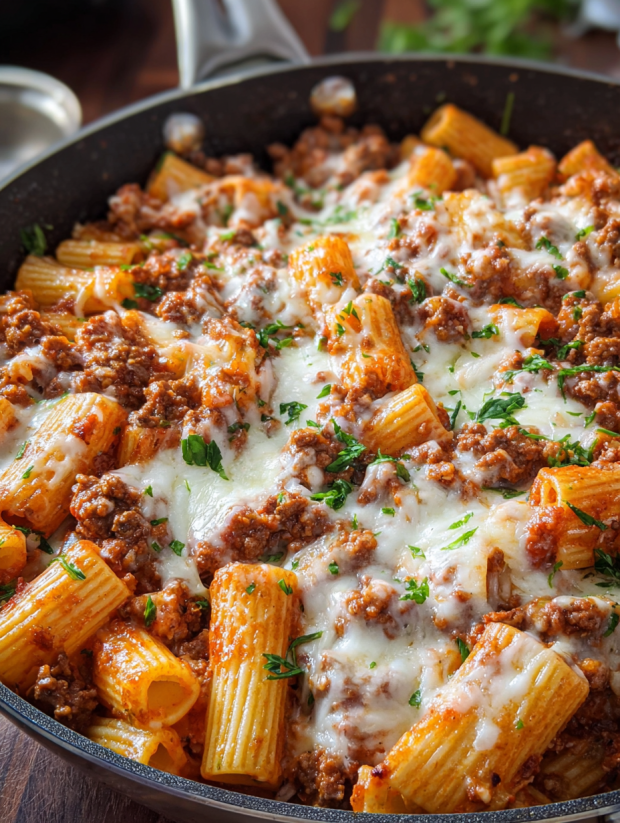 A close up of a delicious cheesy beef rigatoni dish.