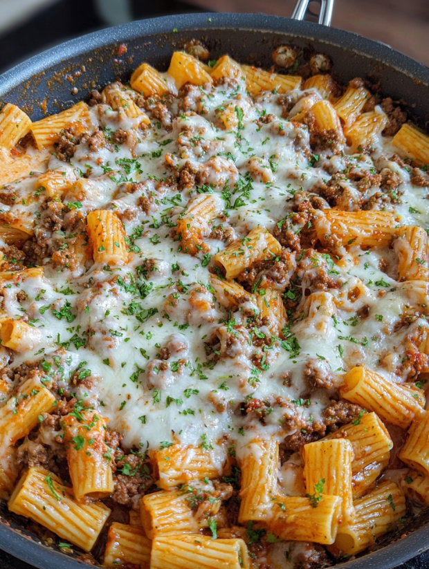 A close up of a delicious cheesy beef rigatoni.