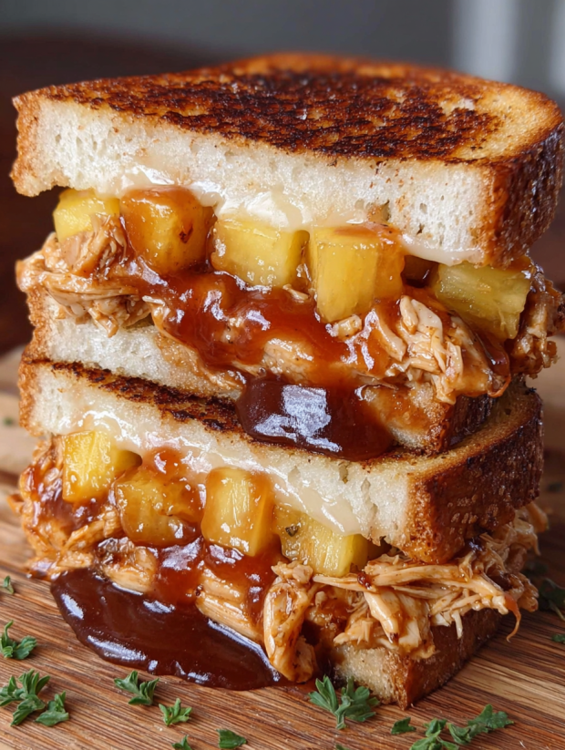 A grilled cheese sandwich with BBQ chicken and pineapple.