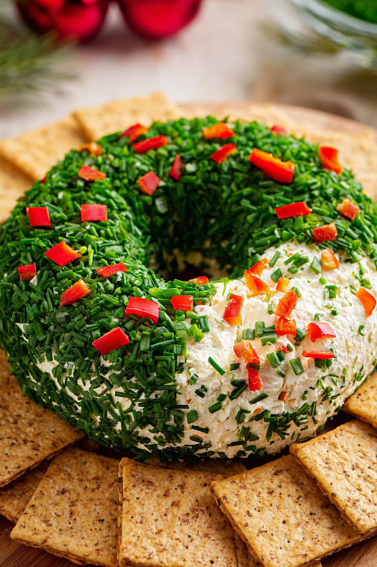 A Christmas cheese ball wreath with chips.