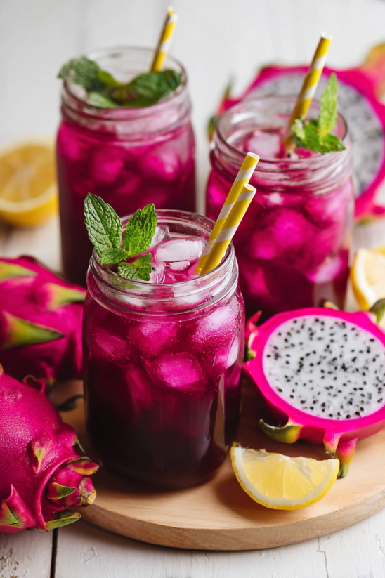 A glass of Starbucks Mango Dragon Fruit Lemonade.