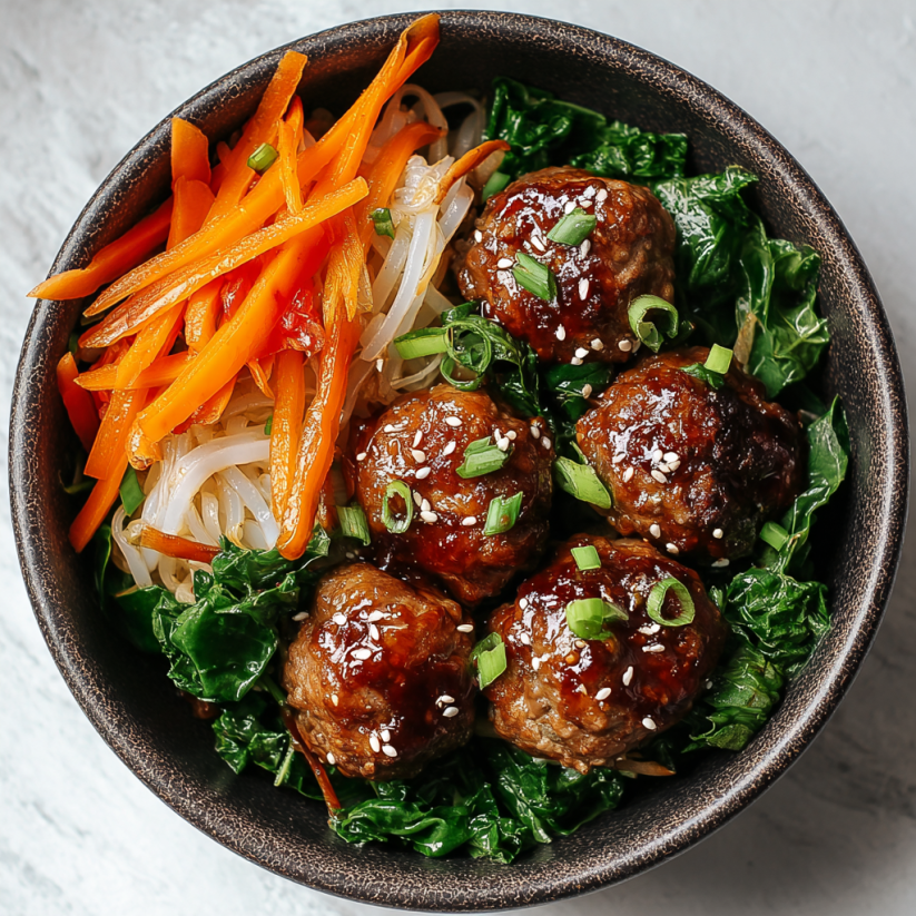 A bowl of meatballs with vegetables.