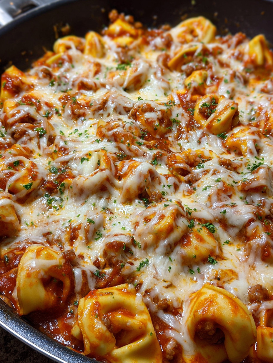 A close up of a cheesy sausage tortellini.