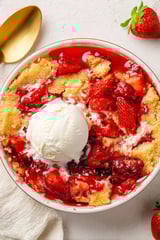 A bowl of strawberry dump cake.