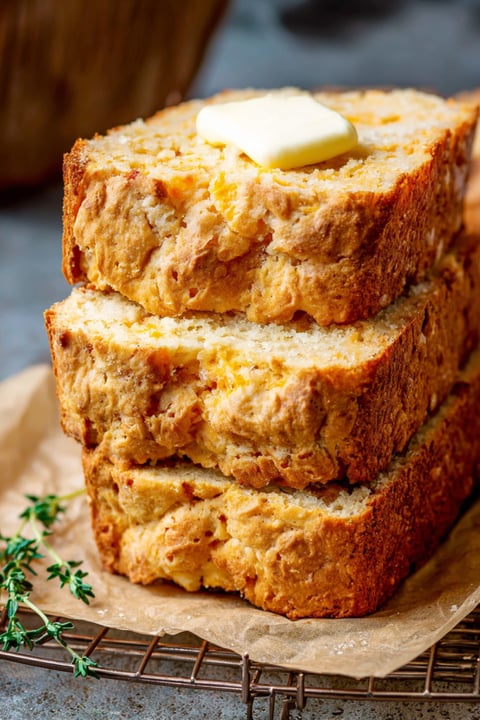 A stack of bread with butter on top.